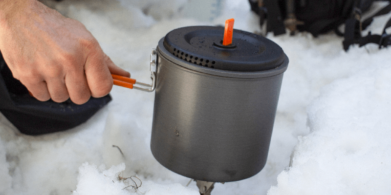 heating up food on a camping stove
